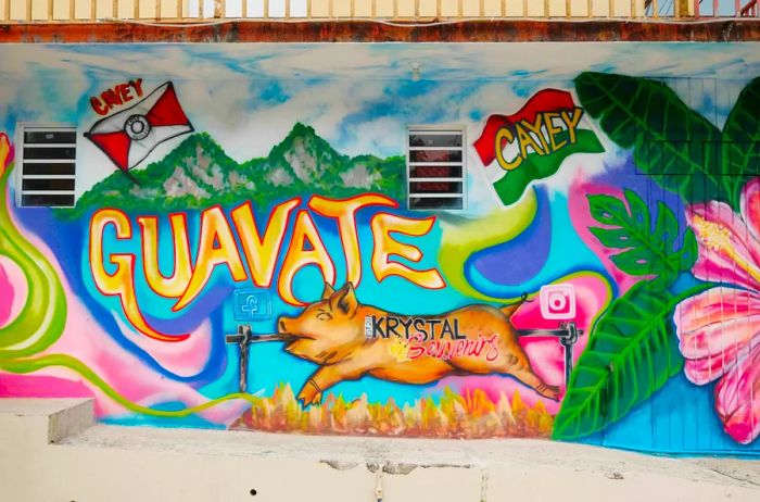 A vibrant mural in pink, blue, and green featuring the word 