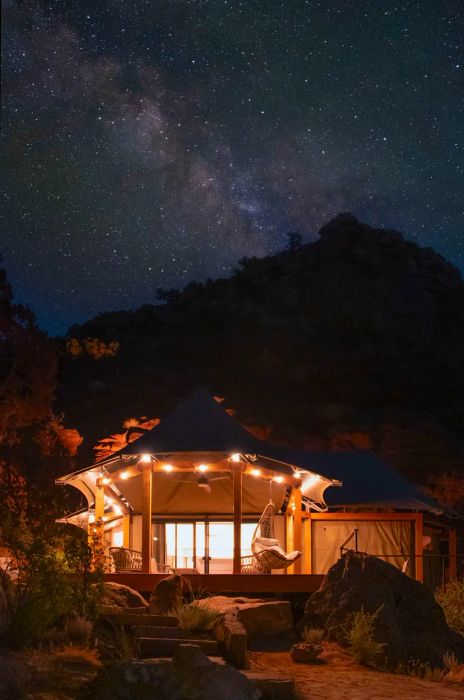 A glowing Open Sky structure beneath the starry expanse near Zion National Park, Utah.