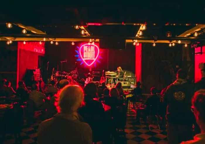 An interior shot of the softly lit Pearl Street Warehouse live music venue located at The Wharf in Washington D.C.