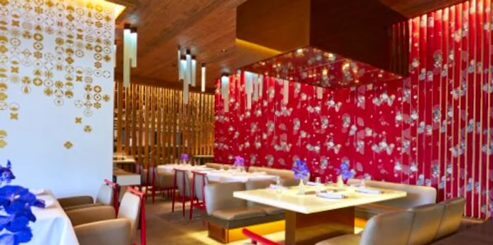 The interior of Megu is adorned with luxurious red patterned silk kimono fabrics.