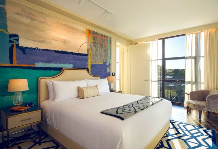 Inside a guest room at the Sophy Hotel, guests can enjoy floor-to-ceiling windows that enhance the sense of space and light.