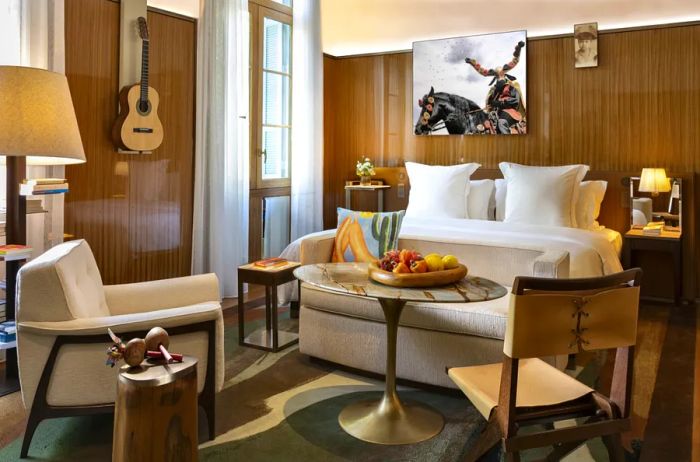 Guest room interior at the Rosewood São Paulo, featuring warm wooden elements and neutral-toned furnishings