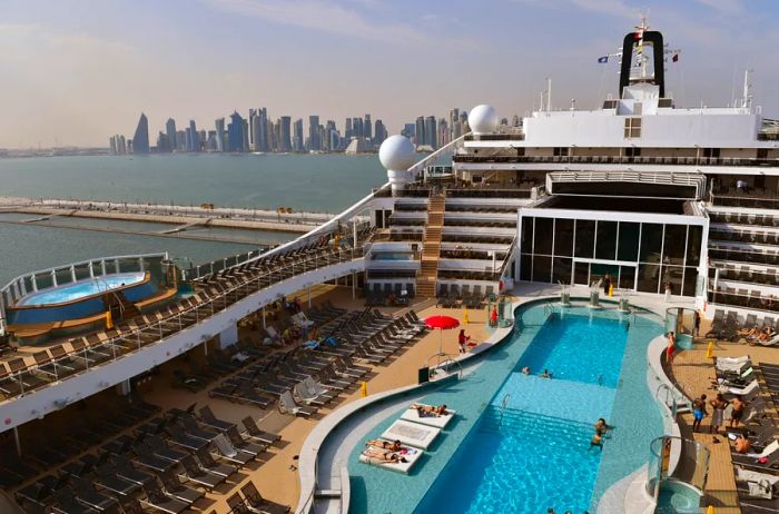 Guests enjoy the poolside on the 'MSC World Europa' prior to its Naming Ceremony on November 12, 2022, in Doha, Qatar.