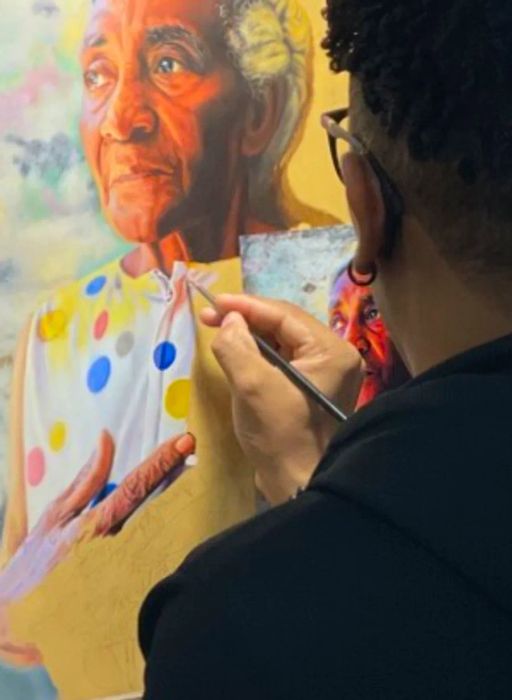 A student creating art at Ani Art Academy in the Dominican Republic.