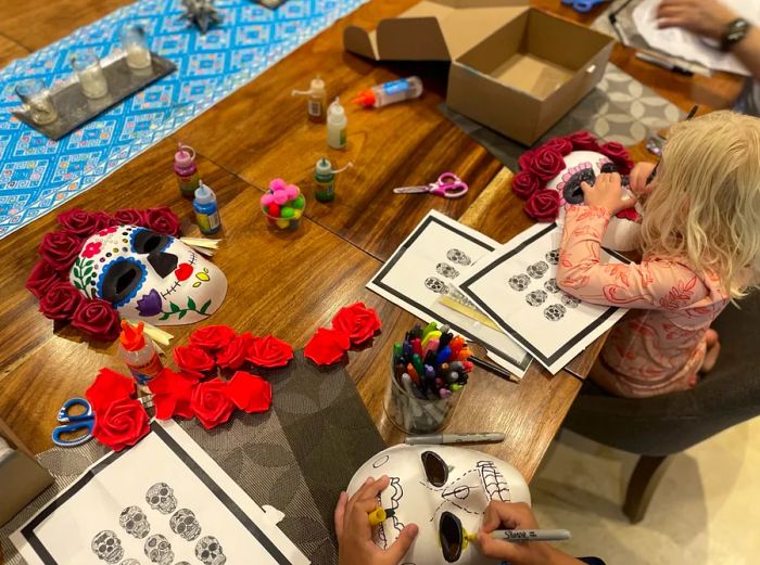 Children creating Catrina masks at the Four Seasons Resort Punta Mita