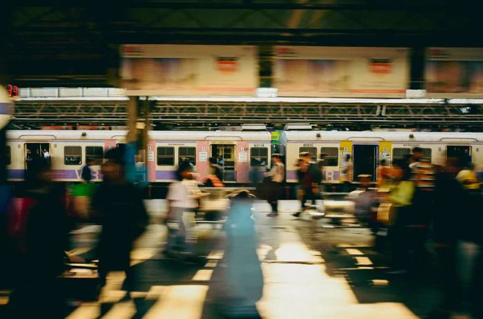 A bustling train station in Mumbai, India.