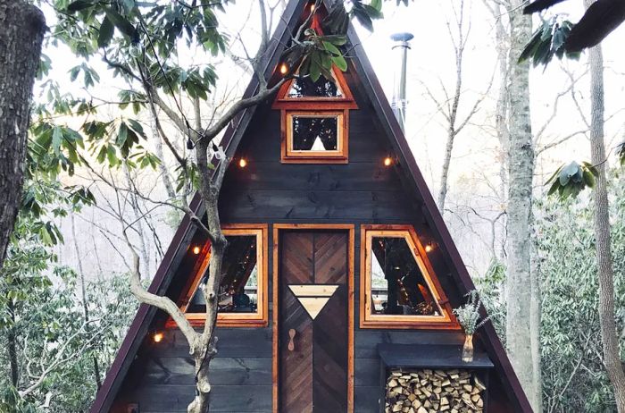 View of a dark A-frame cabin exterior