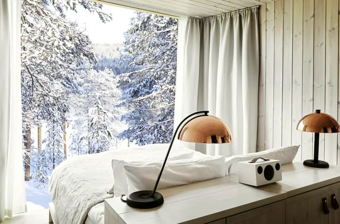 The breathtaking view of the winter wonderland from an Arctic TreeHouse Suite.