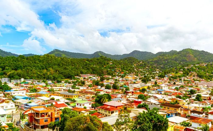 Aerial view of Belmont in Port of Spain, Trinidad, with lush green mountains in the background.