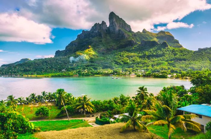 Bora Bora and the breathtaking Mount Otemanu landscape in Tahiti, French Polynesia, featuring a coral lagoon and the majestic peaks of Mt Pahia and Mt Otemanu in the South Pacific Ocean.