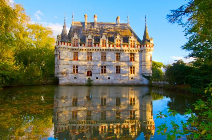 Château d'Azay-le-Rideau, positioned beside the moat that beautifully reflects the château's image