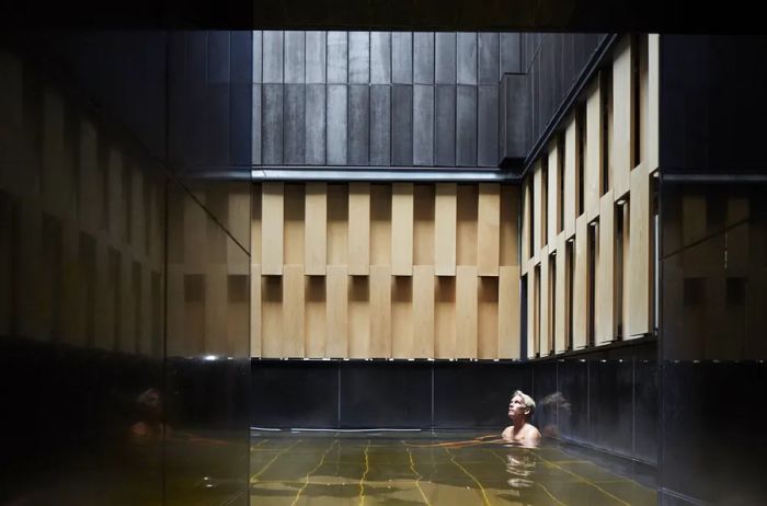 A guest enjoying the onsen at Hoshinoya Tokyo.