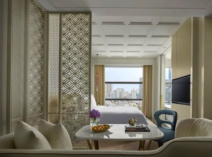 The guest rooms at the Rosewood Bangkok provide views of the Phloen Chit neighborhood.