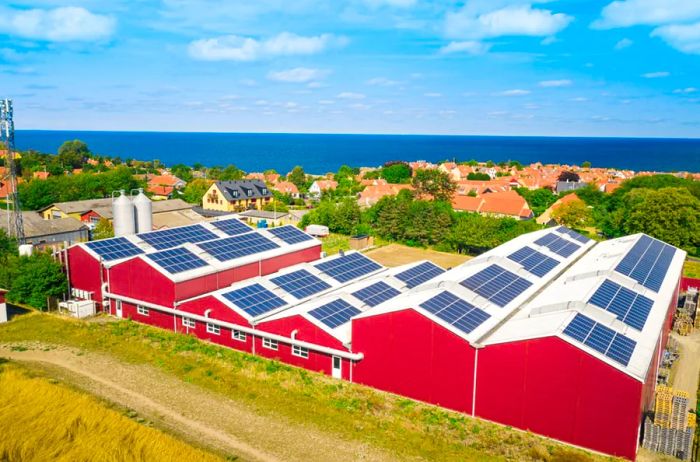 Solar panels in blue atop the red and white Svaneke Brygery.