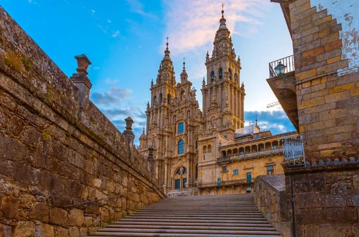 View from broad outdoor stairs to the ornate exterior of the cathedral in Santiago de Compostella