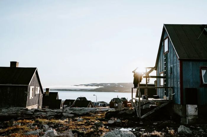 A seaside community of homes in Ittoqqortoormiit, Greenland.