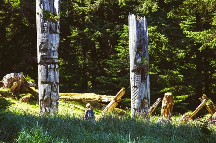 Totem poles at SGang Gwaay Llnagaay, located within Gwaii Haanas National Park Reserve and Haida Heritage Site, Haida Gwaii