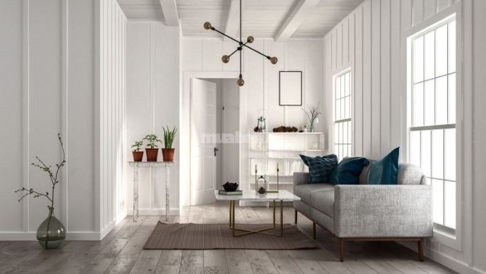 Phòng khách rộng lớn được trang trí với sofa da sang trọng và đèn trần cao cấp tạo điểm nhấn.