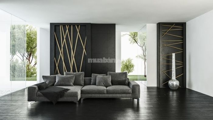 Phòng khách đẹp mắt với thiết kế đèn trần lớn và tranh nghệ thuật độc đáo tạo điểm nhấn.