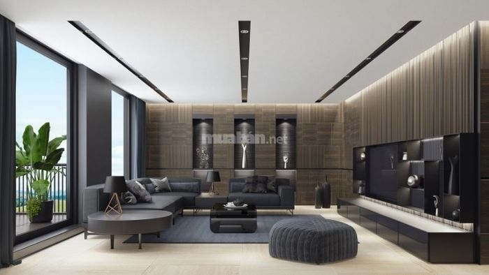Biệt thự với phòng khách hiện đại, trang bị sofa nhung mềm mại, mang lại cảm giác thoải mái và sang trọng.