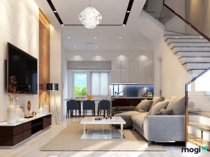 Phòng khách 4m được thiết kế với cầu thang kính, vừa an toàn vừa mang đến vẻ đẹp hiện đại cho không gian.