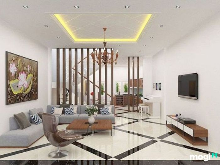 Phòng khách nổi bật với đèn trần cầu kỳ và tranh tường lớn, tạo điểm nhấn ấn tượng cho không gian sống.