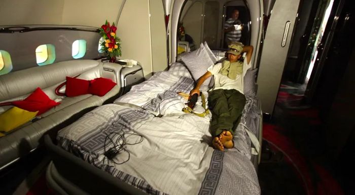 A Libyan rebel takes a break aboard the aircraft at Tripoli in August 2011.