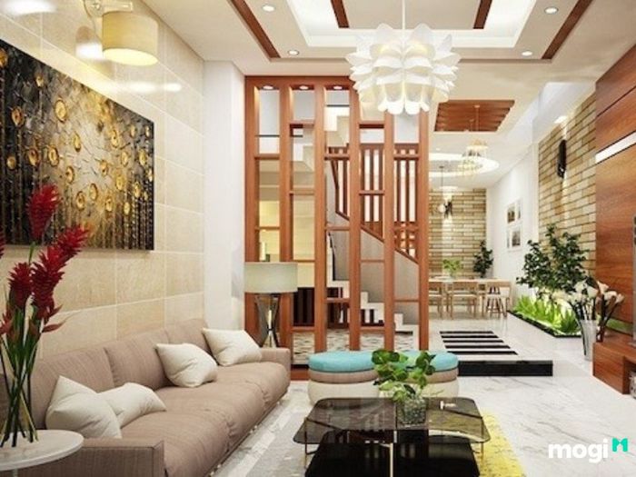 Kệ tủ được sử dụng thông minh trong thiết kế phòng khách, vừa là điểm nhấn vừa giúp tổ chức không gian gọn gàng và tiện nghi.