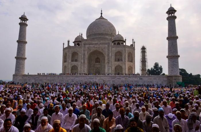 Indian Muslims offer prayers during the Eid al-Adha festival at the mosque within the Taj Mahal in Agra on September 13, 2016.