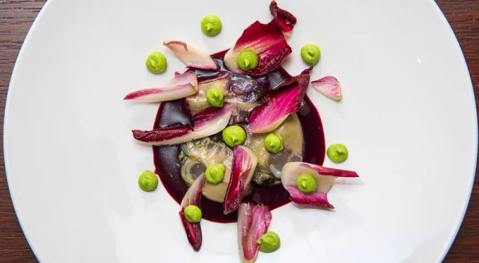 Pierre Gagnaire: A delicate oyster violine paired with broccoli purée and a kick of horseradish.