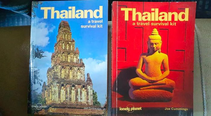 The first (1982) and second (1984) editions of the Lonely Planet Thailand guide.