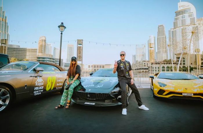 Maximillion Cooper (right) and his wife, Grammy-winning rapper Eve, who had the honor of waving the starting flag in Dubai.