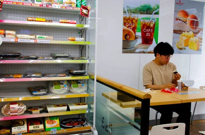 A corporate worker enjoys lunch at a convenience store in Seoul, South Korea, on June 24, 2022.