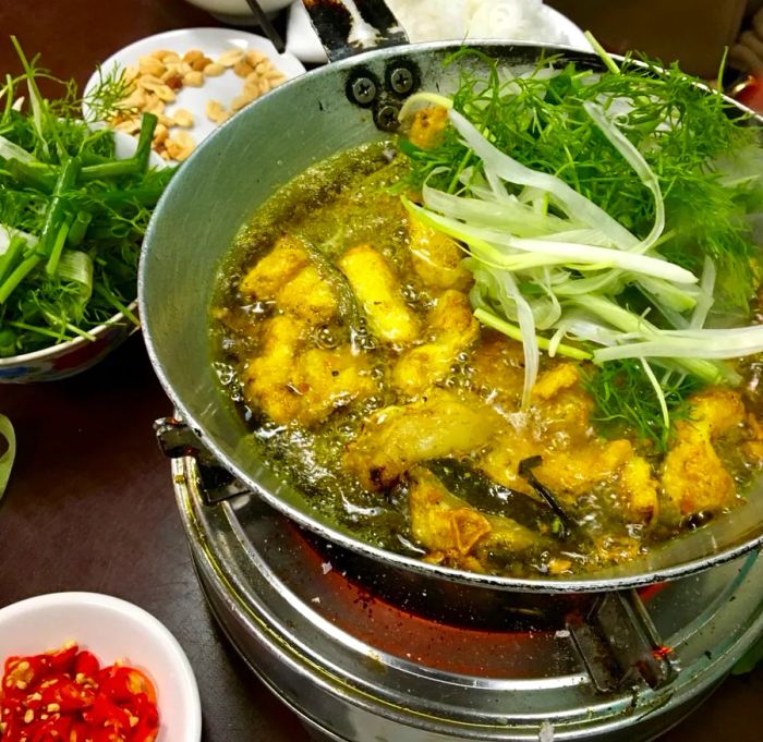 Chả cá is a vermicelli noodle dish featuring turmeric-marinated catfish.