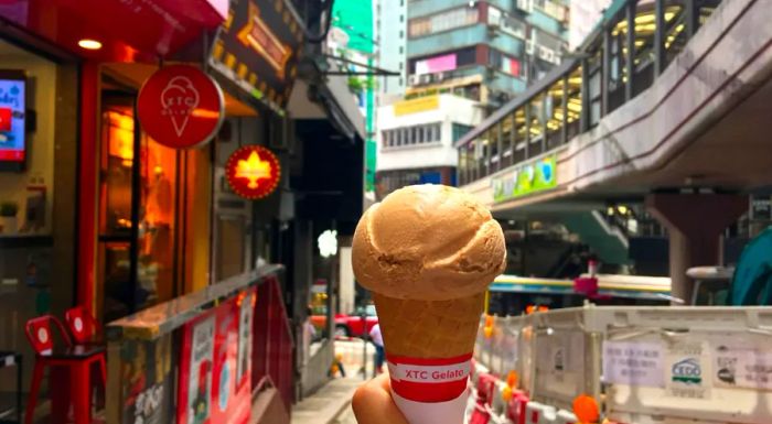 Enjoying a cup of Cantonese milk tea while staying cool at the same time.