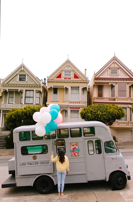 Lady Falcon Coffee Club truck parked in front of the Painted Ladies in San Francisco