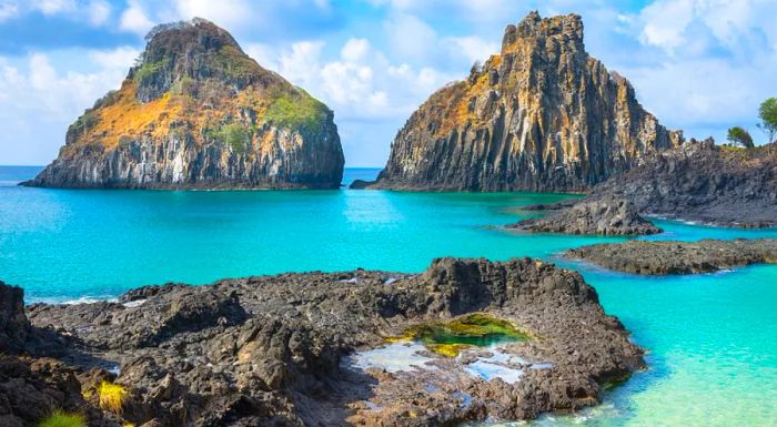 The Dois Irmaos rock formations stand watch over one of Brazil’s most breathtaking, albeit difficult-to-reach, beaches.