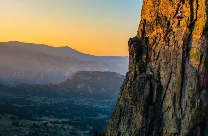 The portaledge feels remarkably small against the backdrop of the expansive Colorado Rockies.