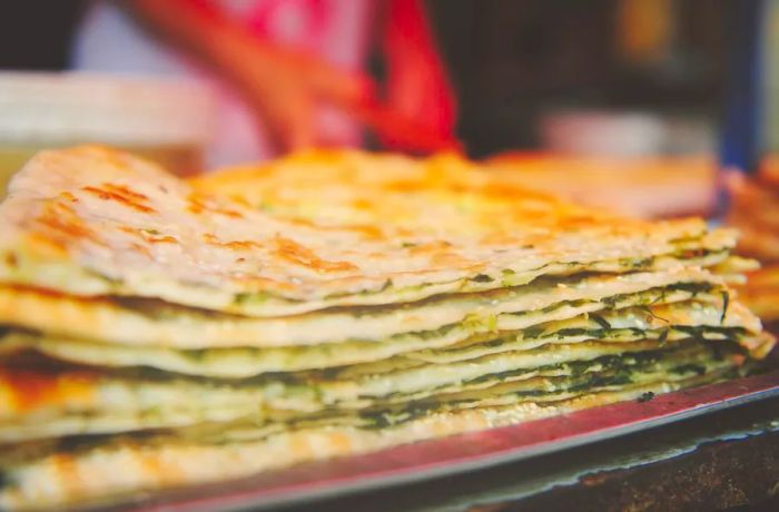 Made from dough and packed with scallions, these savory pancakes make for an ideal breakfast treat.