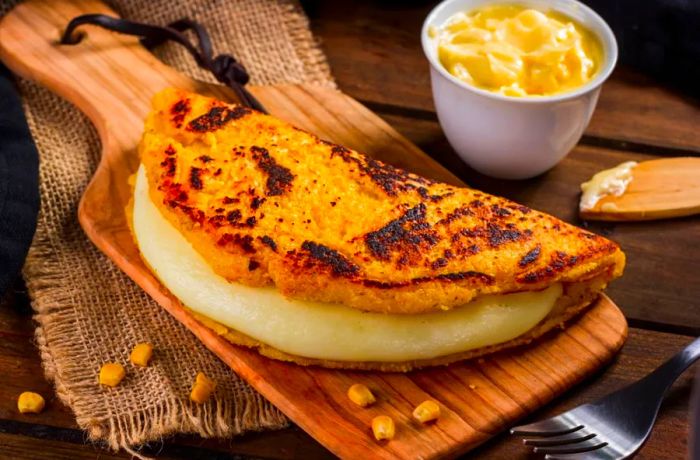 Cachapas, a traditional Venezuelan specialty made from a blend of corn, cheese, and butter, create a delectable dish that's both savory and satisfying.