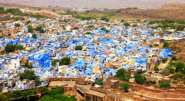 Jodhpur is famous for its blue-painted walls that define the old city, nestled beneath the towering Mehrangarh Fort.