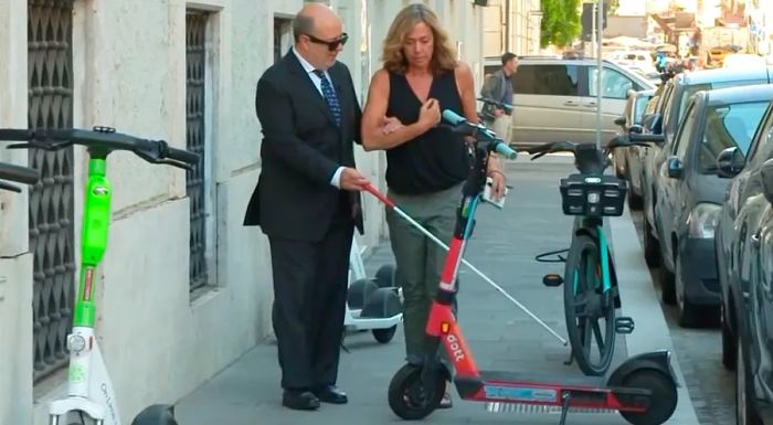 Giuliano Frittelli, pictured left, is pushing for a law that would mandate scooters be parked only in designated areas.