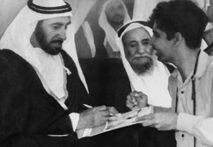 A friend of Shukla captured the moment when Sheikh Zayed autographed his photo at the camel race.