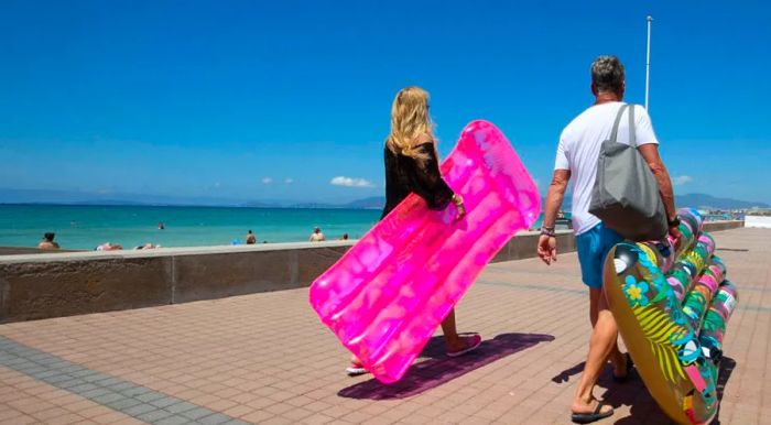 Tourists enjoying Palma Beach in Palma de Mallorca, Spain, in June 2021.