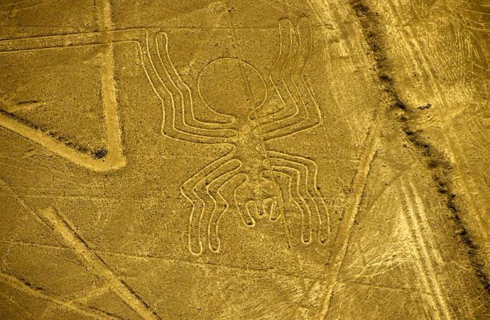 Aerial view of the Spider geoglyph, part of the enigmatic Nazca Lines in Peru, whose purpose remains a subject of mystery.