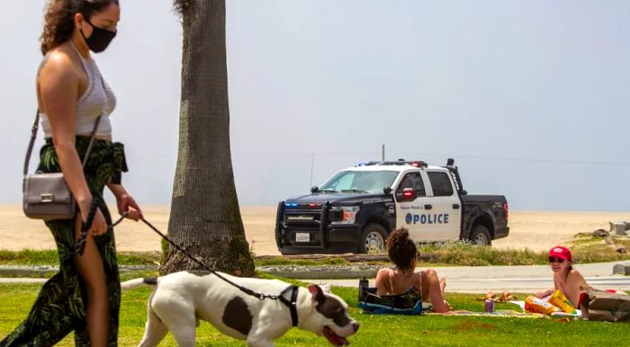 On Saturday, April 25, 2020, Santa Monica police kept a close watch over the deserted beach and the closed bike path, maintaining a strong law enforcement presence along the coast to prevent people from accessing the closed Los Angeles County beaches.