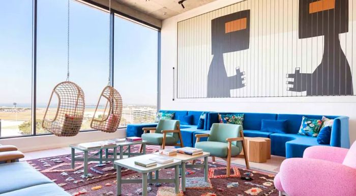 Enjoy the views from the hanging chairs in the Penthouse lobby of Sydney's Felix Hotel.