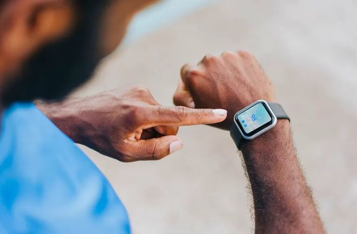 A smartwatch equipped with a heart rate monitor can help athletes track their heart rate and maintain it within a specific range during their workouts.