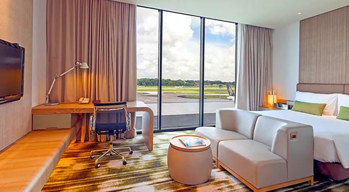 Rooms at Crowne Plaza Singapore Changi offer luxurious accommodations with an unbeatable view of the runway.