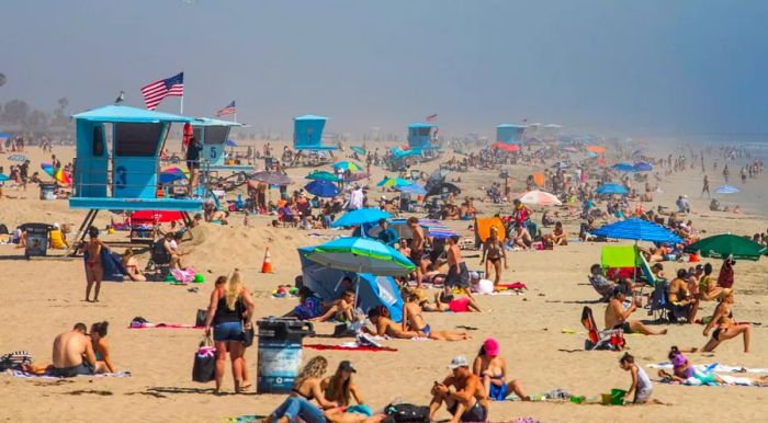 On April 25, 2020, people were seen enjoying the beach at Huntington Beach, California, despite the ongoing coronavirus crisis.